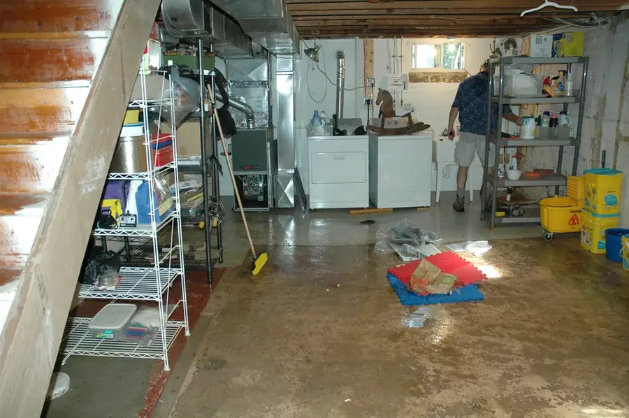 Water spreading across a Hawaiian Gardens kitchen floor from a leaking appliance supply line