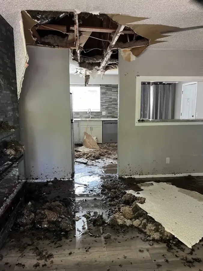 Water-stained and sagging ceiling below an upstairs unit in a Hawaiian Gardens home