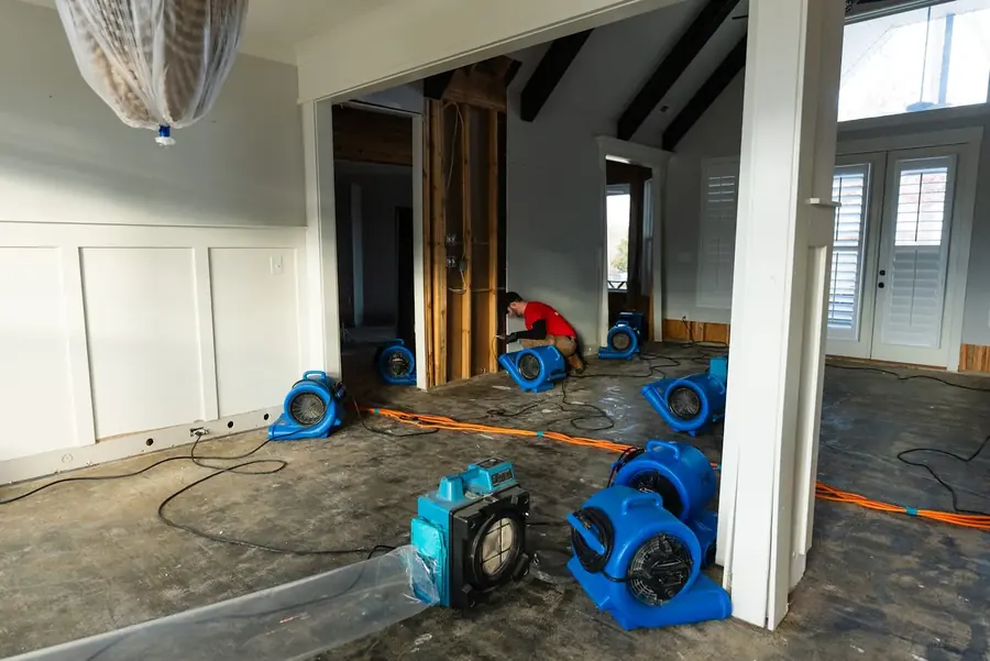 Restoration technicians extracting water in a Hawaiian Gardens home