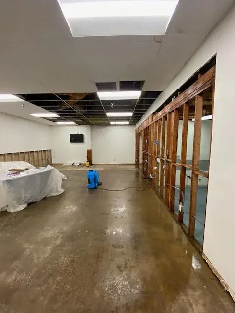 Water damaged ceiling tiles removed in a Gateway Cities building