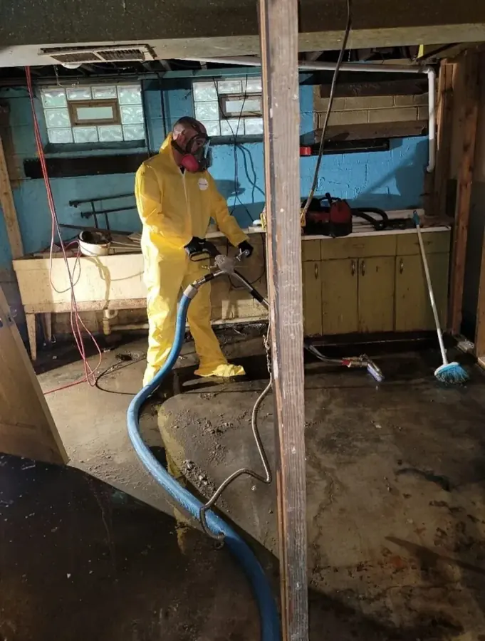 Technician extracting water in a gutted kitchen near Hawaiian Gardens